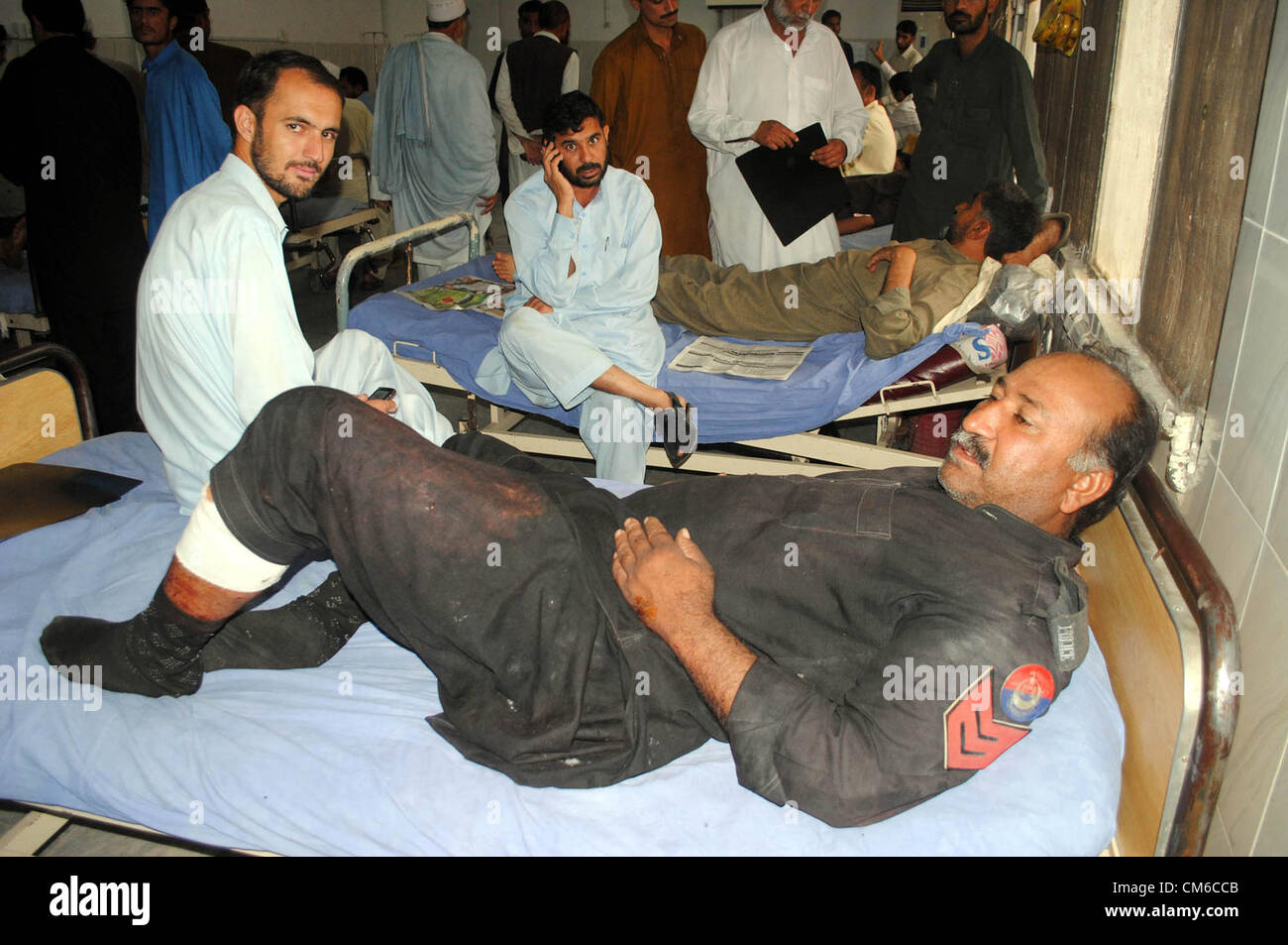 Police officials are admitted for treatment in Lady Reading  Hospital after assailants attack on Matani Police Check Post, in Peshawar on Monday, October 15, 2012 Stock Photo