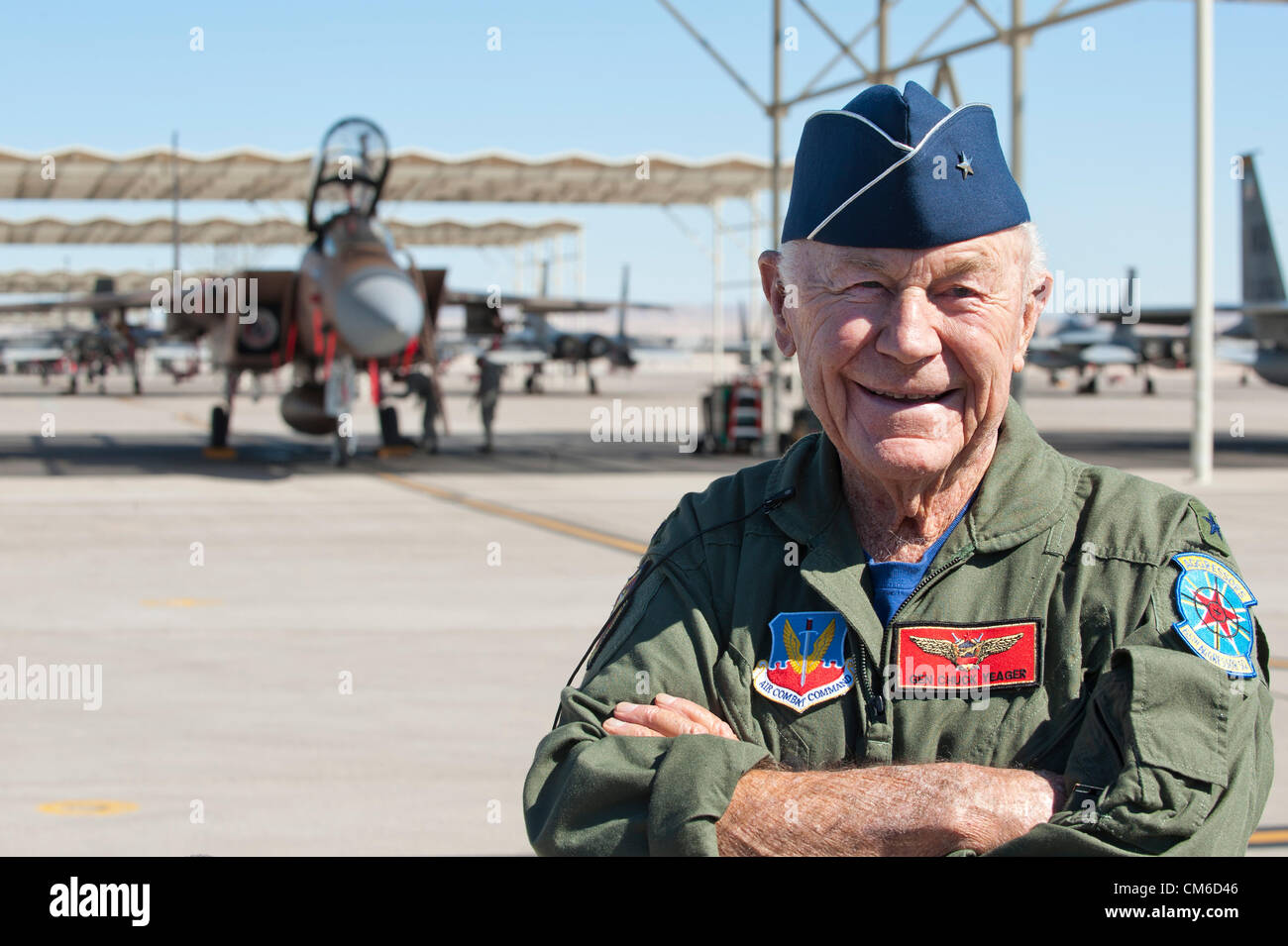 Retired United States Air Force Brig. Gen. Chuck Yeager, 89, smiles after a flight in a F-15D Eagle fighter aircraft to celebrate the 65th anniversary of becoming the first person to break the sound barrier October 14, 2012, at Nellis Air Force Base, Nevada. In 1947 Yeager broke the sound barrier in a Bell XS-1 rocket research plane named Glamorous Glennis. Stock Photo
