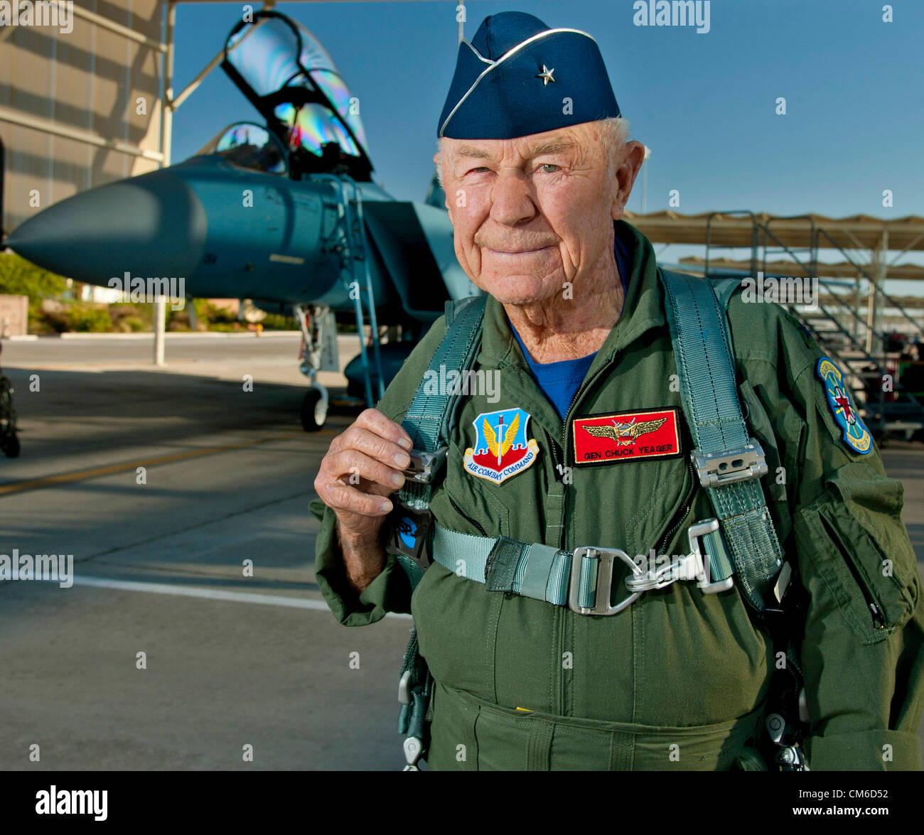 Retired United States Air Force Brig. Gen. Chuck Yeager, 89, smiles before boarding an F-15D Eagle fighter aircraft to celebrate the 65th anniversary of becoming the first person to break the sound barrier October 14, 2012, at Nellis Air Force Base, Nevada. In 1947 Yeager broke the sound barrier in a Bell XS-1 rocket research plane named Glamorous Glennis. Stock Photo