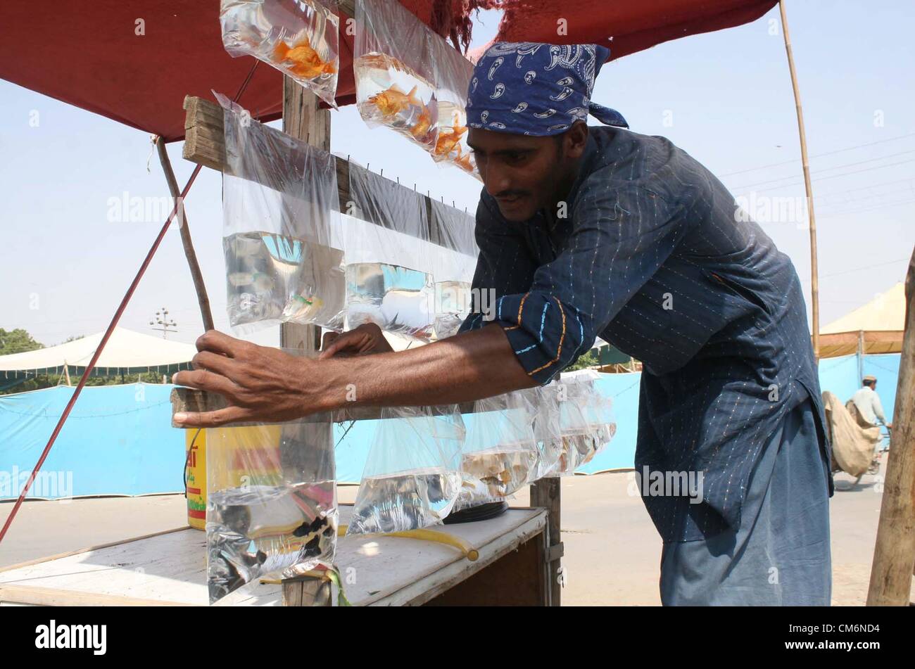 Man busy in knitting fish catching net to earn his livelihood for