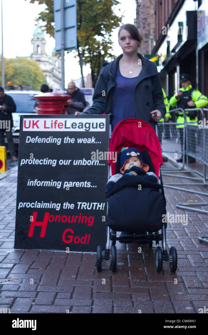 Belfast, UK. 18th October, 2012. Mother with her young son protests against the opening of a Marie Stopes clinic, the first private clinic in Northern ireland to offer abortions. The clinic, which opened today, offers abortions under the law in Northern Ireland. Stock Photo