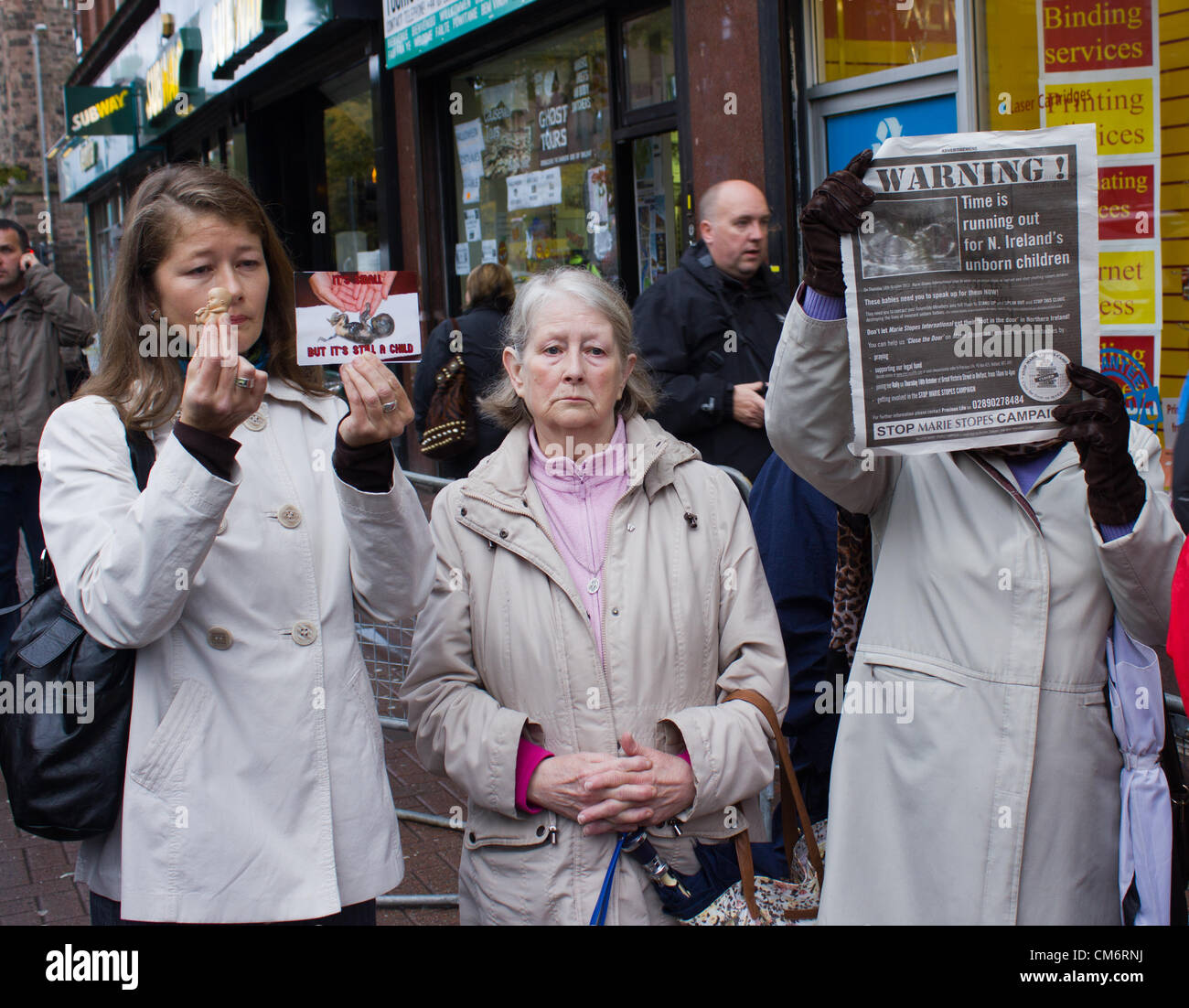 Belfast, UK. 18th October, 2012. Anti-abortion protesters at the opening of the Marie Stopes clinic in Belfast, the first private clinic in Northern ireland to offer abortions. The clinic, which opened today, offers abortions under the law in Northern Ireland. Stock Photo