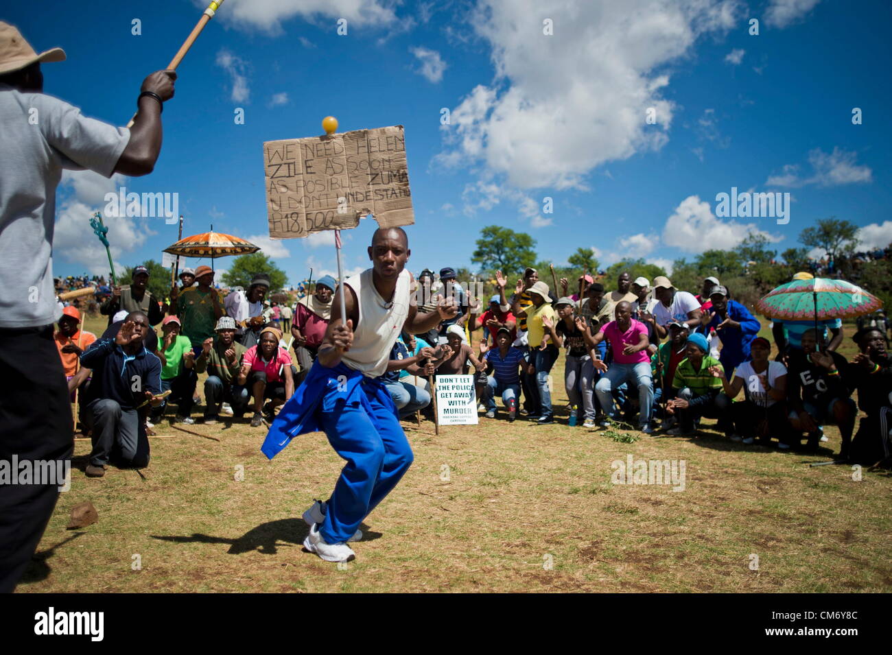 CARLETONVILLE, SOUTH AFRICA: Hundreds of striking gold miners gather at Goldfields KDC West Mine on October 18, 2012 in Carletonville, South Africa. Mine management is planning to start with disciplinary hearings for those miners involved in the illegal strike. (Photo by Gallo Images / Foto24 / Cornel van Heerden) Stock Photo