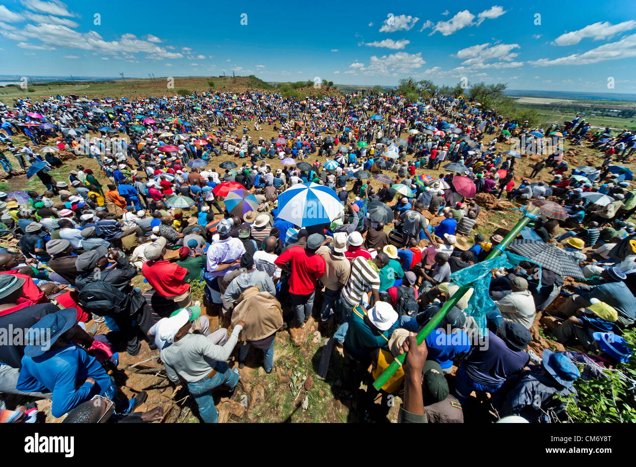 CARLETONVILLE, SOUTH AFRICA: Hundreds of striking gold miners gather at Goldfields KDC West Mine on October 18, 2012 in Carletonville, South Africa. Mine management is planning to start with disciplinary hearings for those miners involved in the illegal strike. (Photo by Gallo Images / Foto24 / Cornel van Heerden) Stock Photo