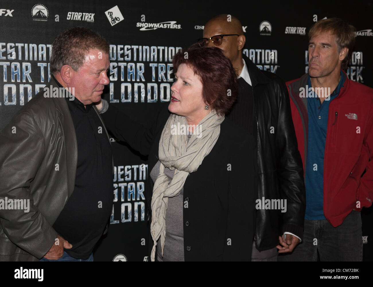 London, England, UK. Friday, 19 October 2012. Photocall with four of the five captains of the Star Trek series (L-R) William Shatner (original series), Kate Mulgrew (Voyager), Avery Brooks (Deep Space Nine) and Scott Bakula (Enterprise) at Destination Star Trek. Sir Patrick Stewart who played Captain Jean-Luc Picard in The Next Generation refused to join his fellow actors for the photocall although he was standing only yards away. Stars are enticing Patrick Stewart to join in. The Convention takes place at the ExCel Exhibition Centre in East London from 19-21 October 2012. Photo credit: Nick S Stock Photo