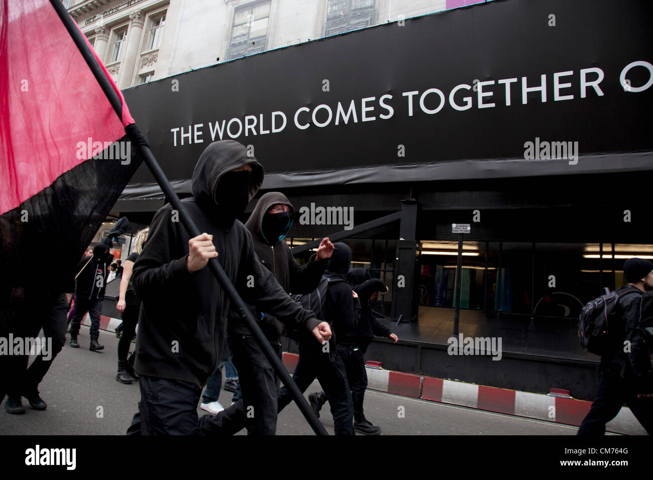 London, UK. Saturday 20th October 2012. Members of the Balck Bloc anarchists group confuse cause confusion in central London during the TUC (Trades Union Congress) march 'A Future That Works'. Demonstration against austerity cuts by the government. Credit:  Michael Kemp / Alamy Live News Stock Photo