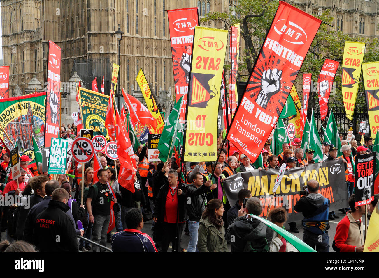 RMT Union members and supporters march past the Houses of Parliament during  the TUC anti-austerity march. London, October 2012. Stock Photo