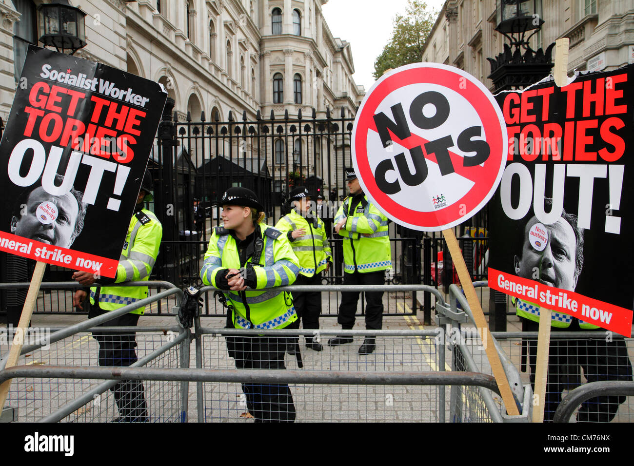 Anti-government placards at the entrance of Downing Street during the TUC anti-austerity march. London.  20th. October 2012 Stock Photo