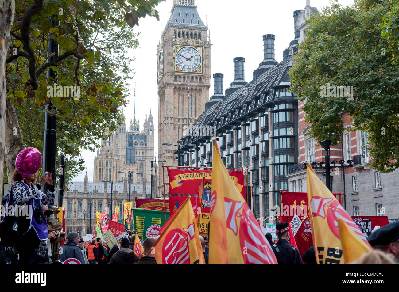 20/10/2012, London UK. Union banners fly as the TUC stage a mass protest against the UK government's austerity cuts. A march through central London culminated in a rally in Hyde Park Stock Photo