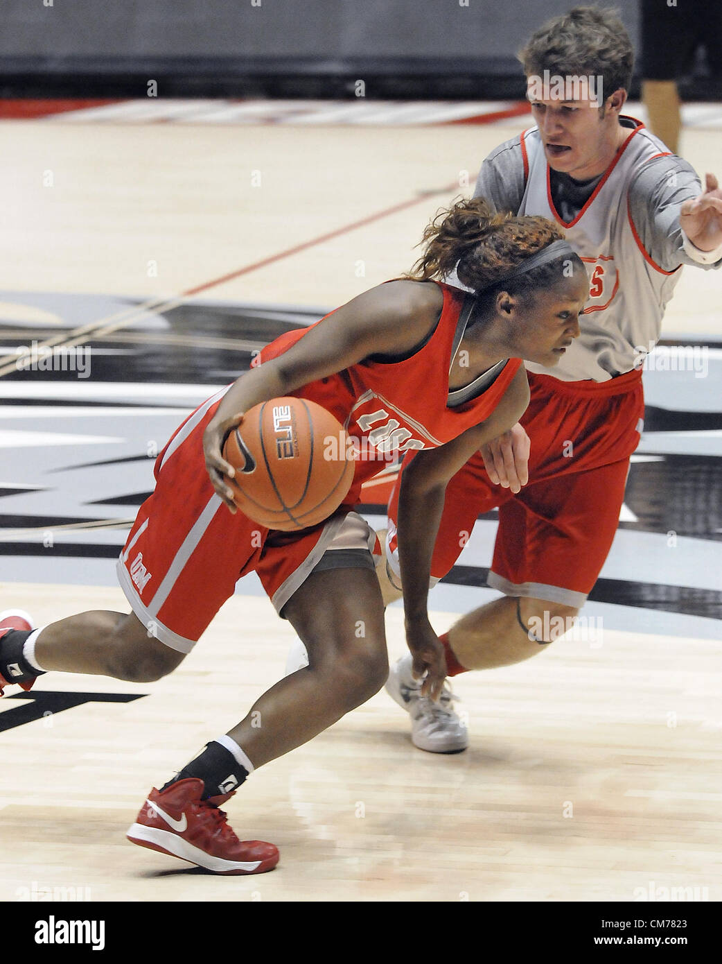 Oct. 20, 2012 - Albuquerque, NM, U.S. - UNM's #12 Bryce Owens drives  towards the paint with Jack Russell guarding her all the way during the  cherry/silver scrimmage Saturday night in the