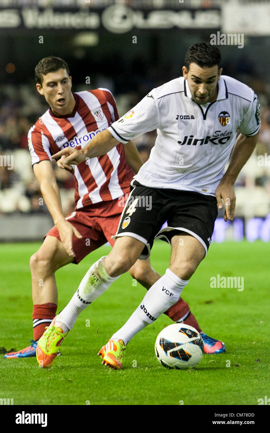 20.10.2012 Valencia, Spain. Defender Adil Rami (L) of Valencia CF is challenged by Forward Oscar de Marcos of Athletic Bilbao  during the La Liga game between Valencia and Athletico Bilbao from the Mestalla Stadium. Stock Photo