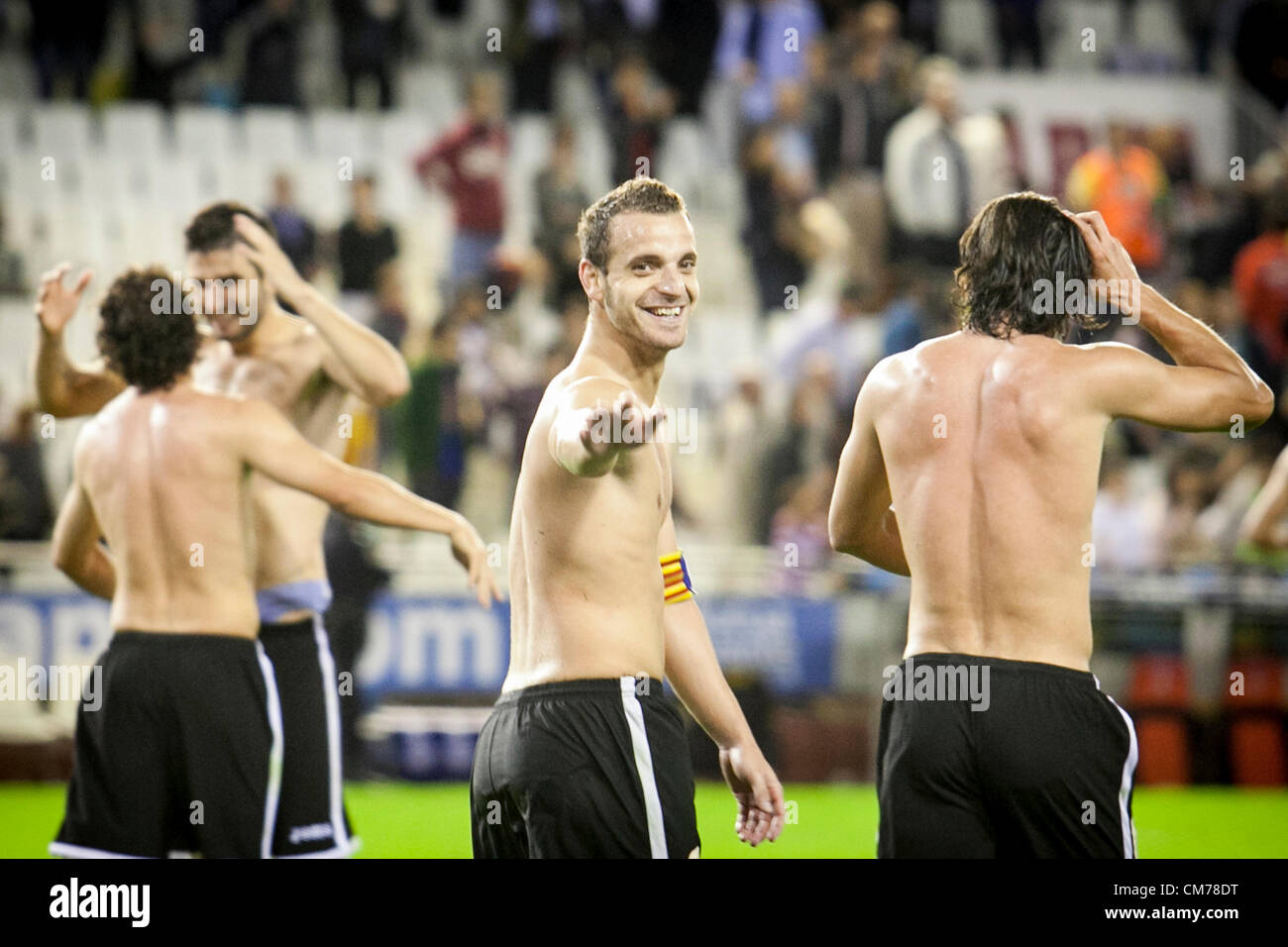 20.10.2012 Valencia, Spain. Valencia players thanks to Mestalla public their support giving away their t-shirts after an epic comeback (from L to R)  Guardado, Victor Ruiz, Soldado, Valdez, during the La Liga game between Valencia and Athletico Bilbao from the Mestalla Stadium. Stock Photo