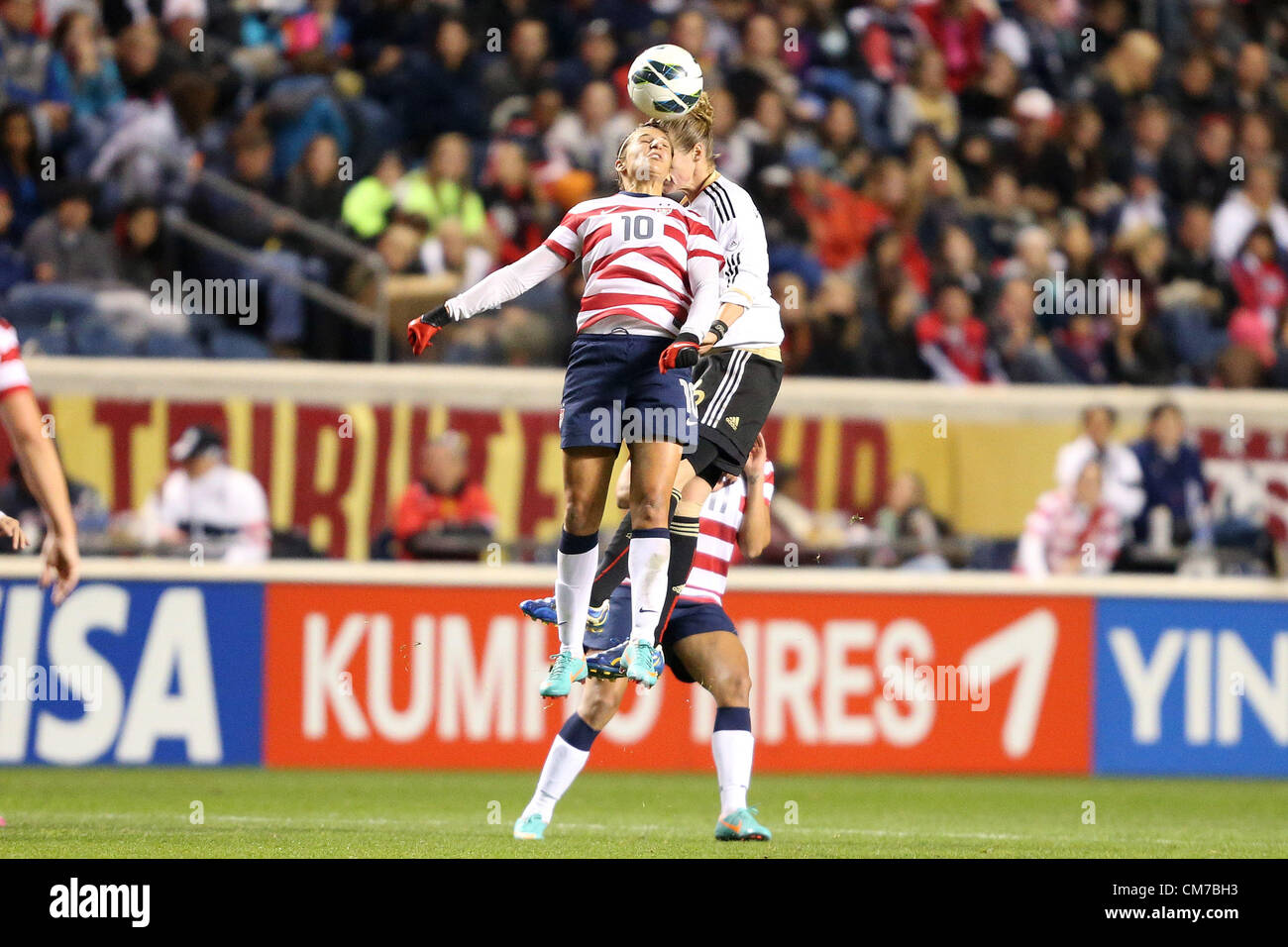 20.10.2012. Chicago, USA.  Carli Lloyd (USA) (10) and Simone Laudehr (GER) (6) challenge for a header. The United States Women's National Team played the Germany Women's National Team at Toyota Park in Bridgeview, Illinois in a women's international friendly soccer match. The game ended in a 1-1 tie. Stock Photo