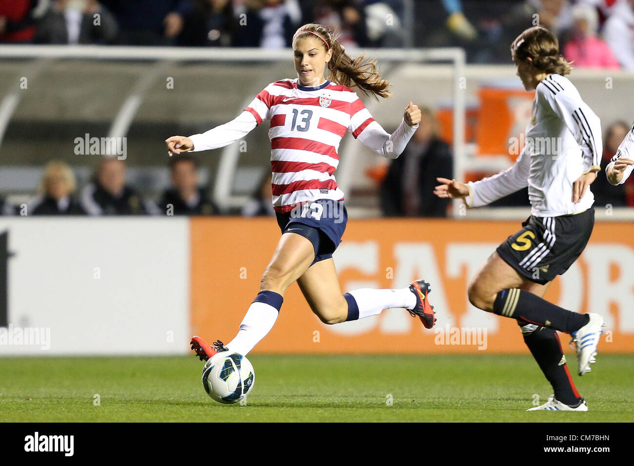 20.10.2012. Chicago, USA.  Alex Morgan (USA) (13) is defended by Annike Krahn (GER) (5). The United States Women's National Team played the Germany Women's National Team at Toyota Park in Bridgeview, Illinois in a women's international friendly soccer match. The game ended in a 1-1 tie. Stock Photo