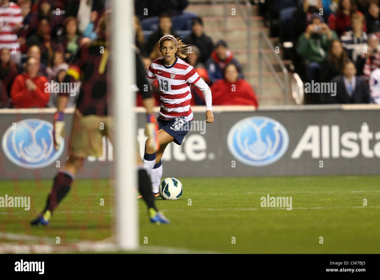 20.10.2012. Chicago, USA.  Alex Morgan (USA) (13) and Nadine Angerer (GER) (1). The United States Women's National Team played the Germany Women's National Team at Toyota Park in Bridgeview, Illinois in a women's international friendly soccer match. The game ended in a 1-1 tie. Stock Photo