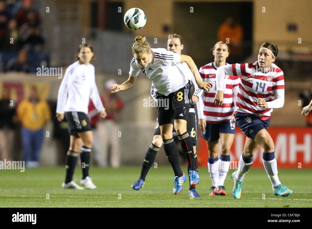 20.10.2012. Chicago, USA.  Kim Kulig (GER) (8) heads the ball away from Abby Wambach (USA) (14). The United States Women's National Team played the Germany Women's National Team at Toyota Park in Bridgeview, Illinois in a women's international friendly soccer match. The game ended in a 1-1 tie. Stock Photo