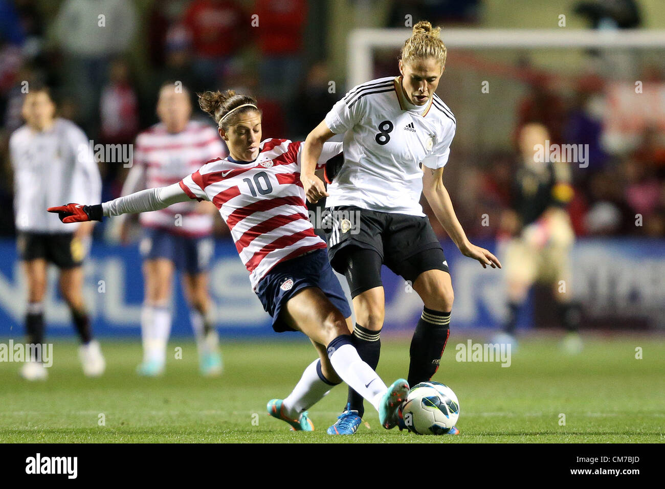 20.10.2012. Chicago, USA.  Carli Lloyd (USA) (10) tackles the ball away from Kim Kulig (GER) (8). The United States Women's National Team played the Germany Women's National Team at Toyota Park in Bridgeview, Illinois in a women's international friendly soccer match. The game ended in a 1-1 tie. Stock Photo