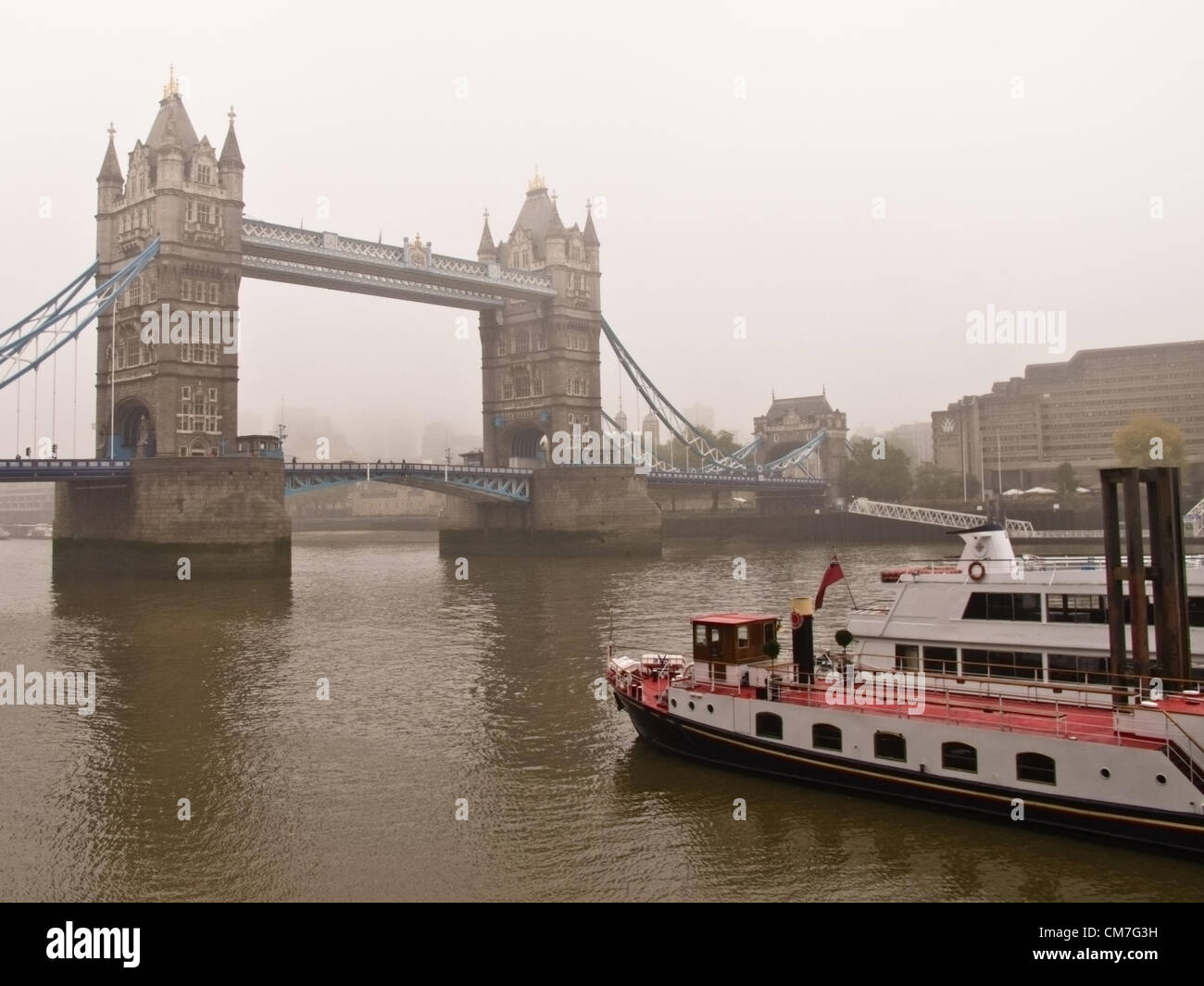 London, England - October, 22nd 2012: A heavy fog around Tower Bridge today in London as flights were affected from London's Heathrow and City airports Stock Photo