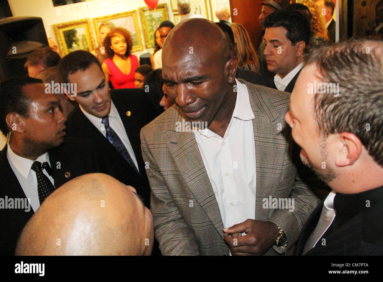 Oct. 19, 2012 - Los Angeles, California, USA - Five time World Heavy Weight Champion Evander ''The Real  Deal'' Holyfield with guests as he celebrates his 50th  birthday with a celebration and auction of his memorabilia  at Julien's Auctions in Beverly Hills, CA. on Friday October  19, 2012. (Credit Image: © Burt Harris/Prensa Internacional/ZUMAPRESS.com) Stock Photo
