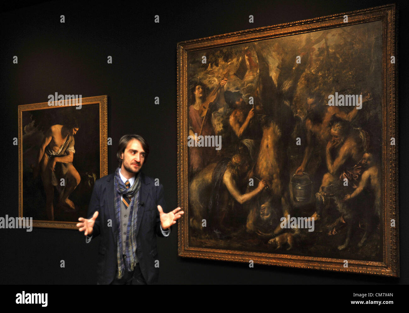 Olomouc, Czech Republic, October 24, 2012. Curator Ondrej Zatloukal is seen in front of one of the most expensive works of art in the Czech Republic called The Flaying of Marsyas by Titian during the exhibition From Titian to Warhol in Olomouc Museum of Art in Olomouc, Czech Republic, October 24, 2012.(CTK Photo/Vladislav Galgonek) Stock Photo