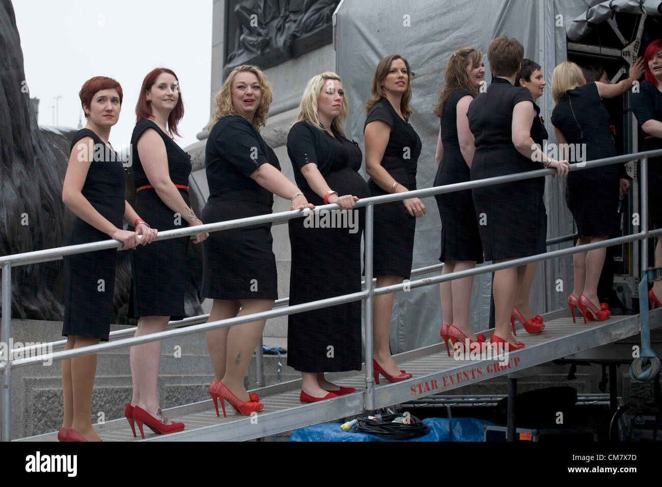 24th October 2012. London UK. Military Wives Choir from RAF Wattingsham in Suffolk are invited to perform in  free a concert during the National Launch of the Royal British Legion Poppy Appeal  in Trafalgar Square. The  aim of the Poppy appeal is to  raise 42 Million pounds to help service personel and their families. The Choir was formed  in January 2012  by Sally Wilkinson when her husband was in operations in Afghanistan Credit:  amer ghazzal / Alamy Live News Stock Photo