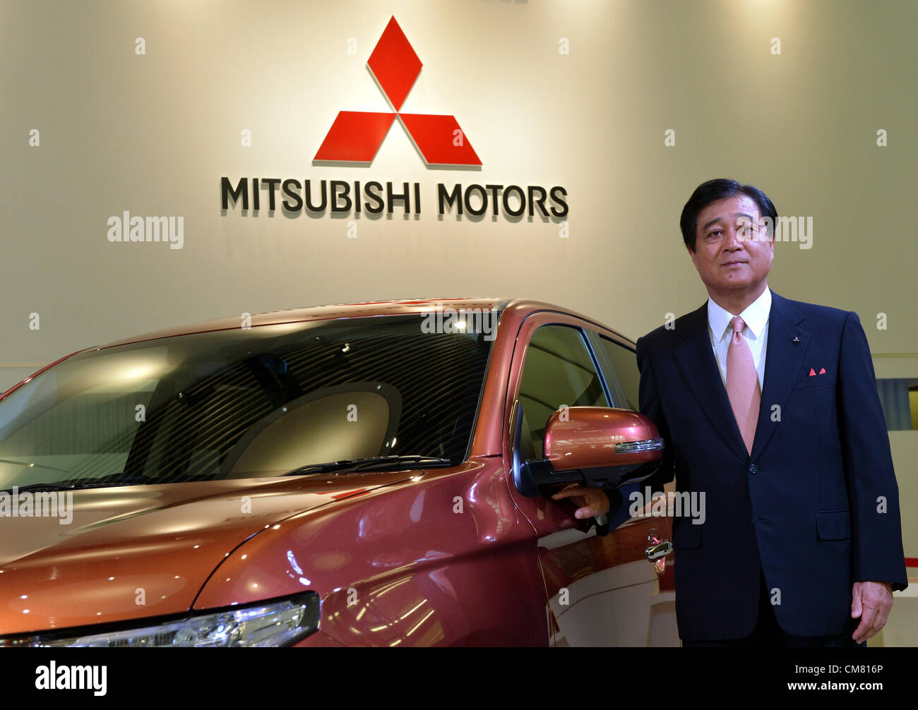 October 25, 2012, Tokyo, Japan - President Osamu Mashiko of Mitsubishi Motors poses with the all new SUV Outlander during a launch at its head office in Tokyo on Thursday, October 25, 2012. The new Outlander comes in a 2.4-liter four-wheel-drive model and a 2.0-liter two-wheel-drive version. (Photo by Natsuki Sakai/AFLO) AYF -mis- Stock Photo