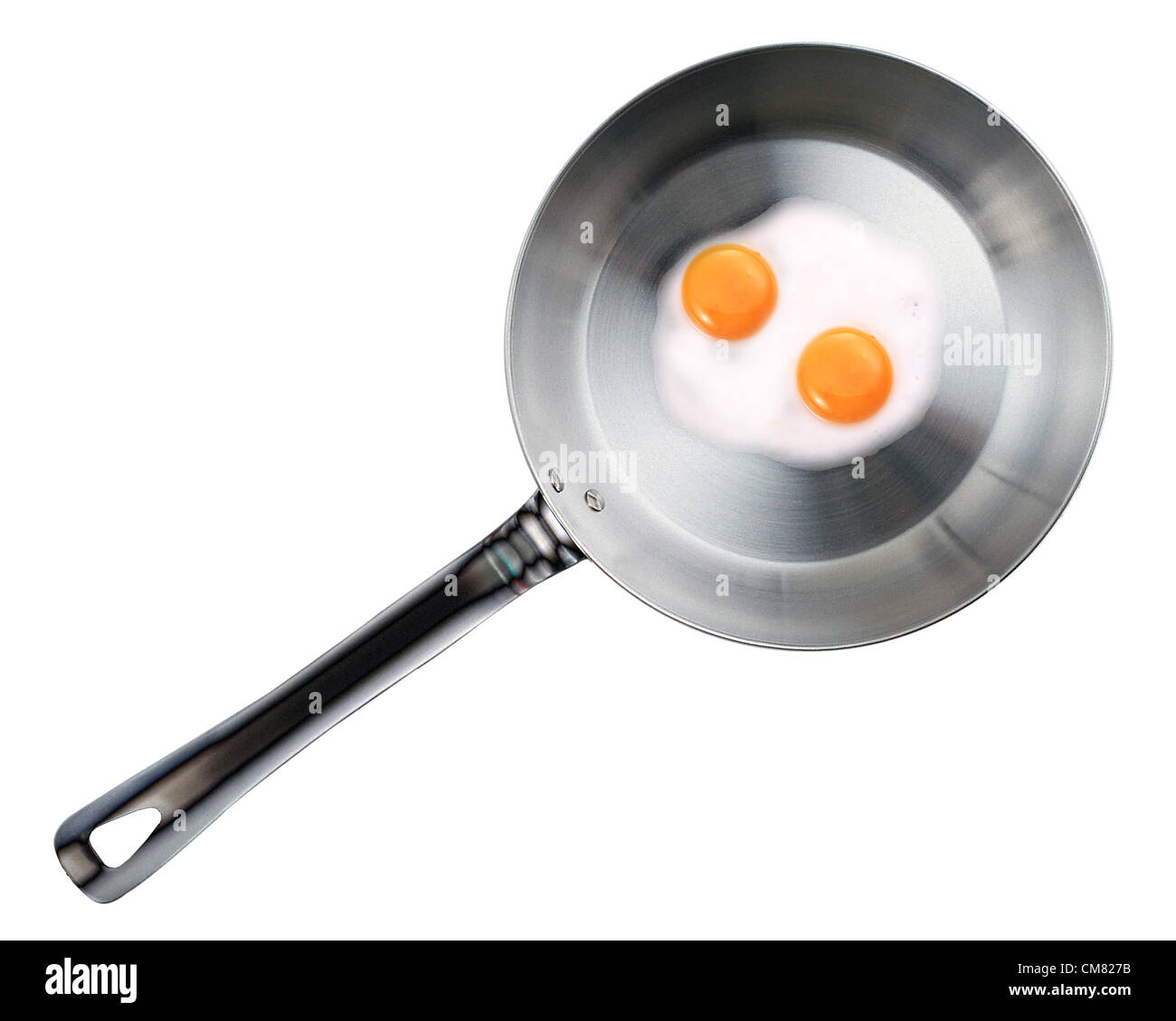 Frying pan with Fried eggs isolated on white background Stock Photo - Alamy