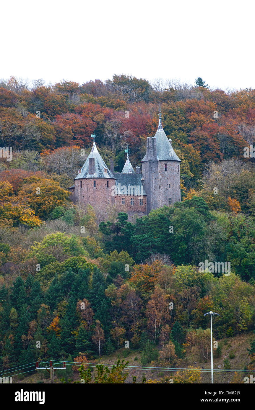 Tongwynlais, South Wales, UK. 25th October 2012. A burst of Autumn colour is seen on the trees that surround Castle Coch which is nestled on the hillside high above the small village of Tongwynlais, north of Cardiff. Castell Coch (which means Red Castle in Welsh) is a 19th-century Gothic Revival Castle built on the remains of a genuine 13th-century fortification. Stock Photo