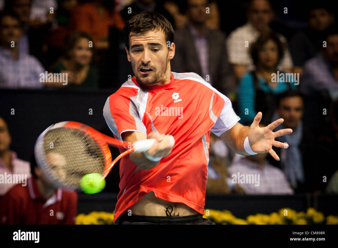 Marin Cilic of Croatia plays a forehand return to Norbert Gombos of Slovakia during their second round match at the Australian Open tennis championships in Melbourne, Australia, Thursday, Jan