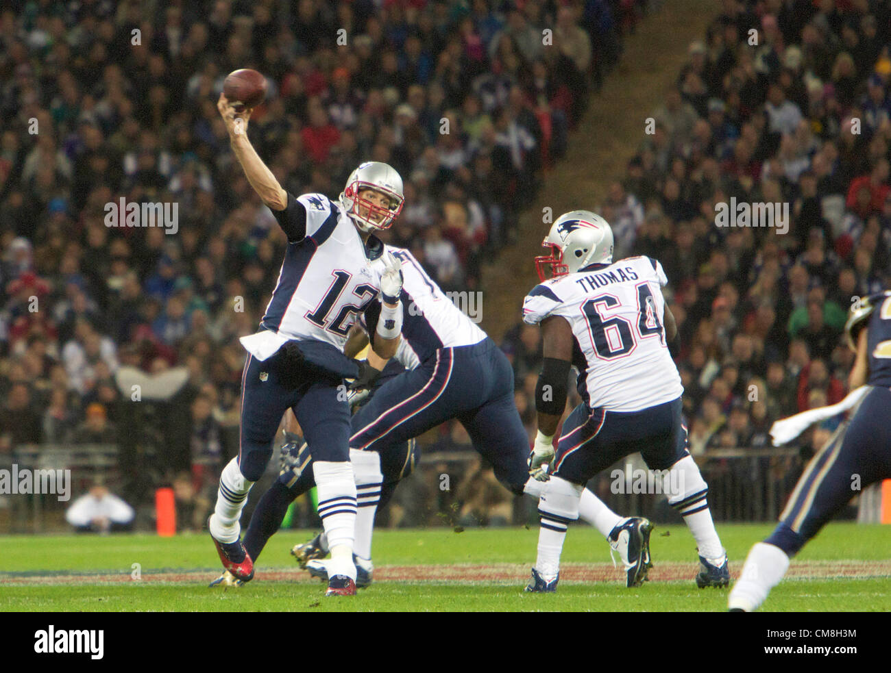 28.10.2012 London, England.  NE Patriots QB Tom Brady throws a TD pass during the NFL International Series 2012 game between The Bill Belichick and Tom Brady led New England Patriots and The St Louis Rams from Wembley Stadium. Stock Photo