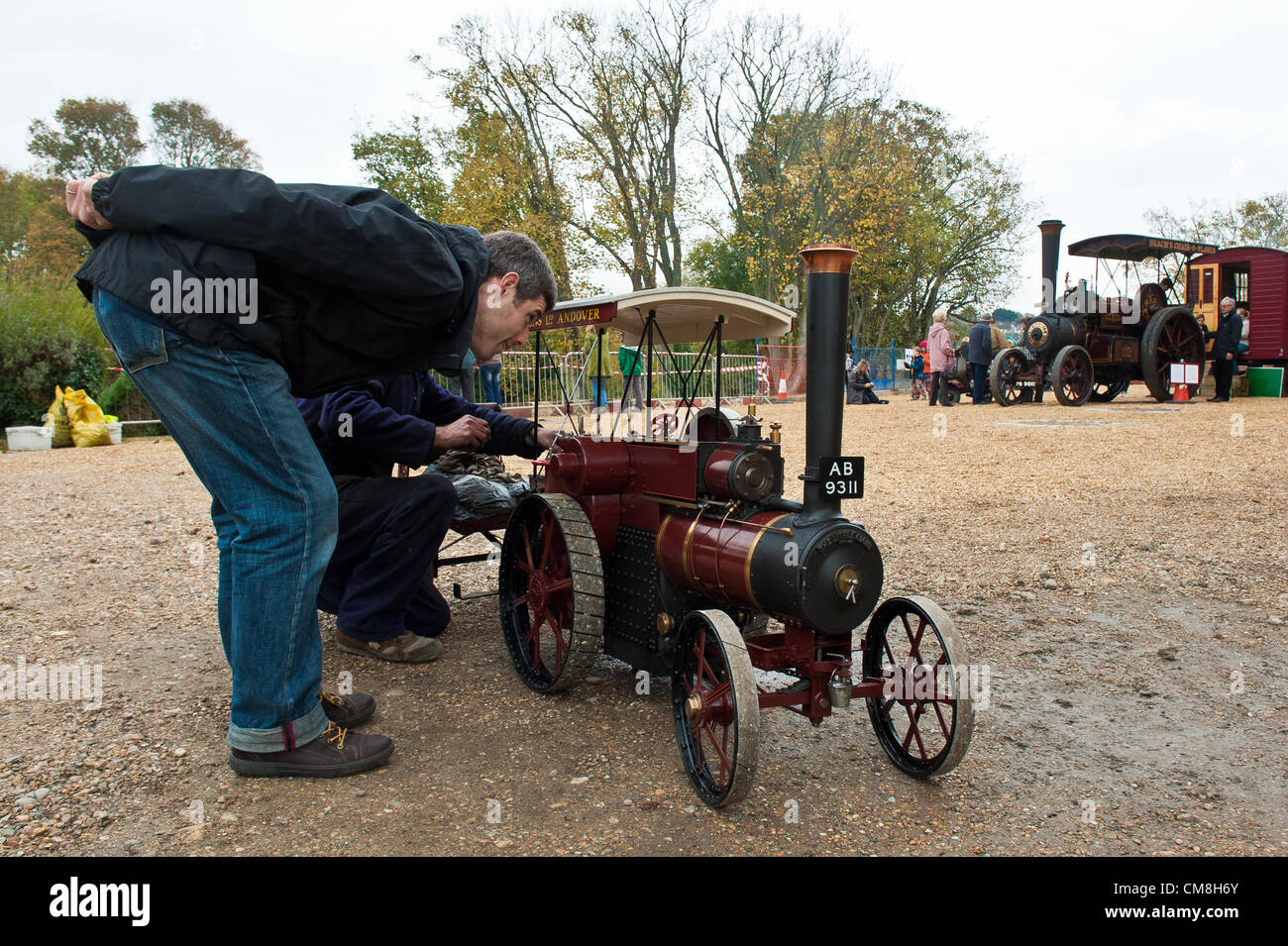 Brighton and Hove, UK. 28th October, 2012. Visitors admire the Little Giant - a third of full size replica of an engine from the early 1900's that took owner Andrew Breese 18 years to build. A rare open day at The British Engineerium, Hove.   photo©Julia Claxton Stock Photo