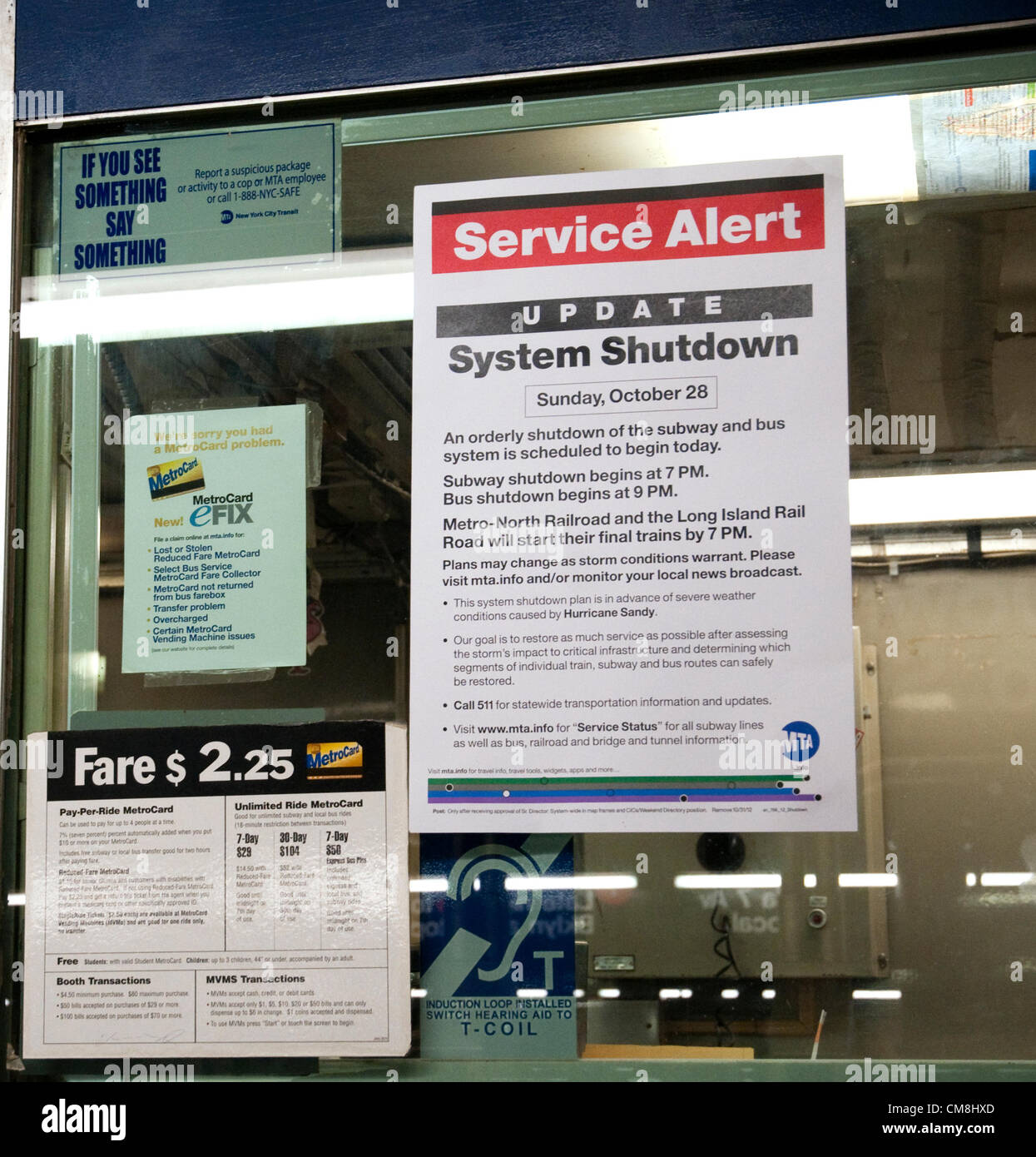 New York City, USA. 28th October, 2012.  Sign in a New York CIty subway station announcing the closing of the mass transit system at 7PM on Saturday, October 28th in anticipation of flooding from Hurricane Sandy. Rainfall is expected to start late Sunday or early Monday in New York City with an anticipated storm surge of 6 to 11 feet. Stock Photo