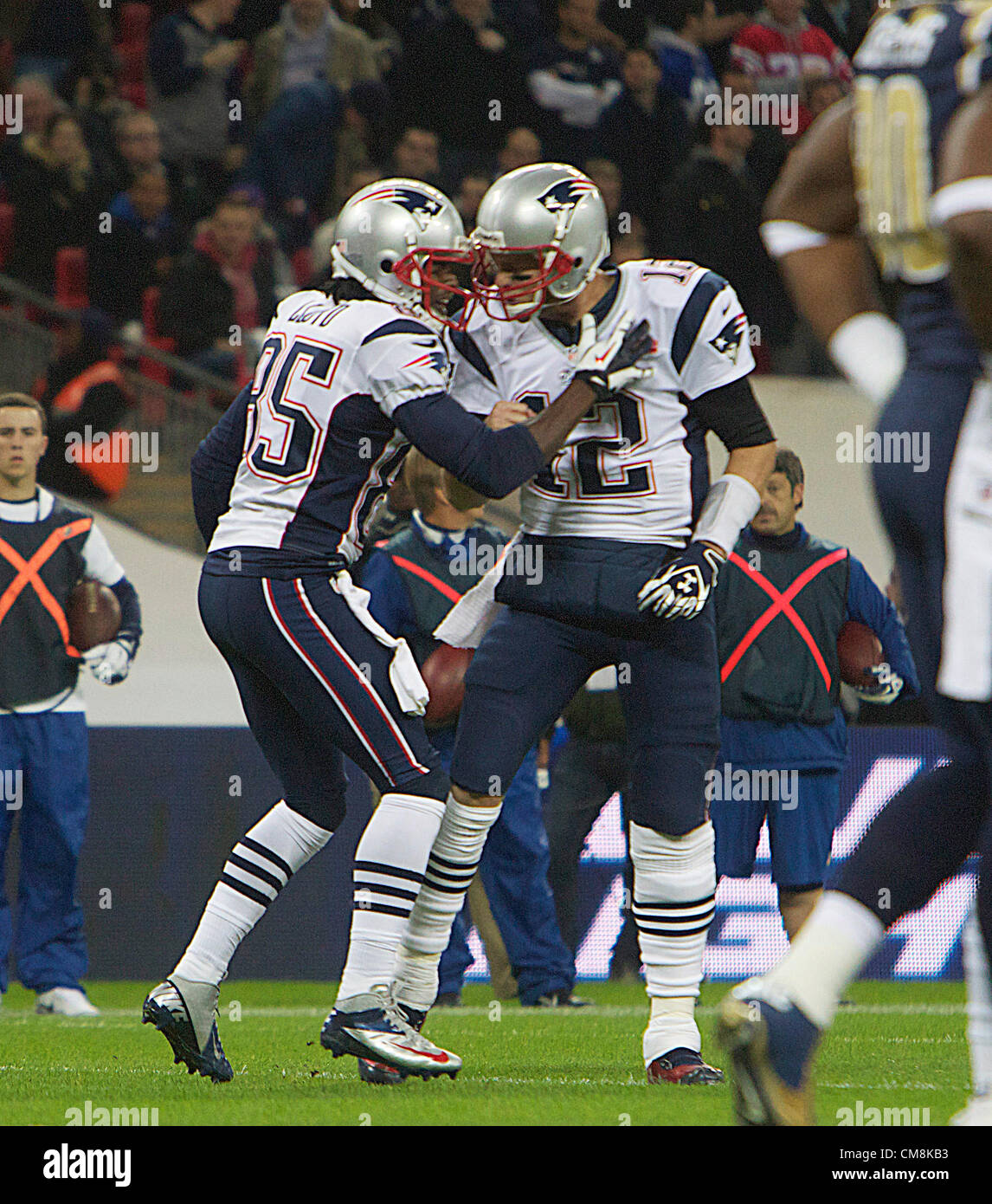 28.10.2012 London, England. NE Patriots QB Tom Brady celebrates after he  throws a TD pass with TD scorer WR Brandon Lloyd during the NFL  International Series 2012 game between The Bill Belichick
