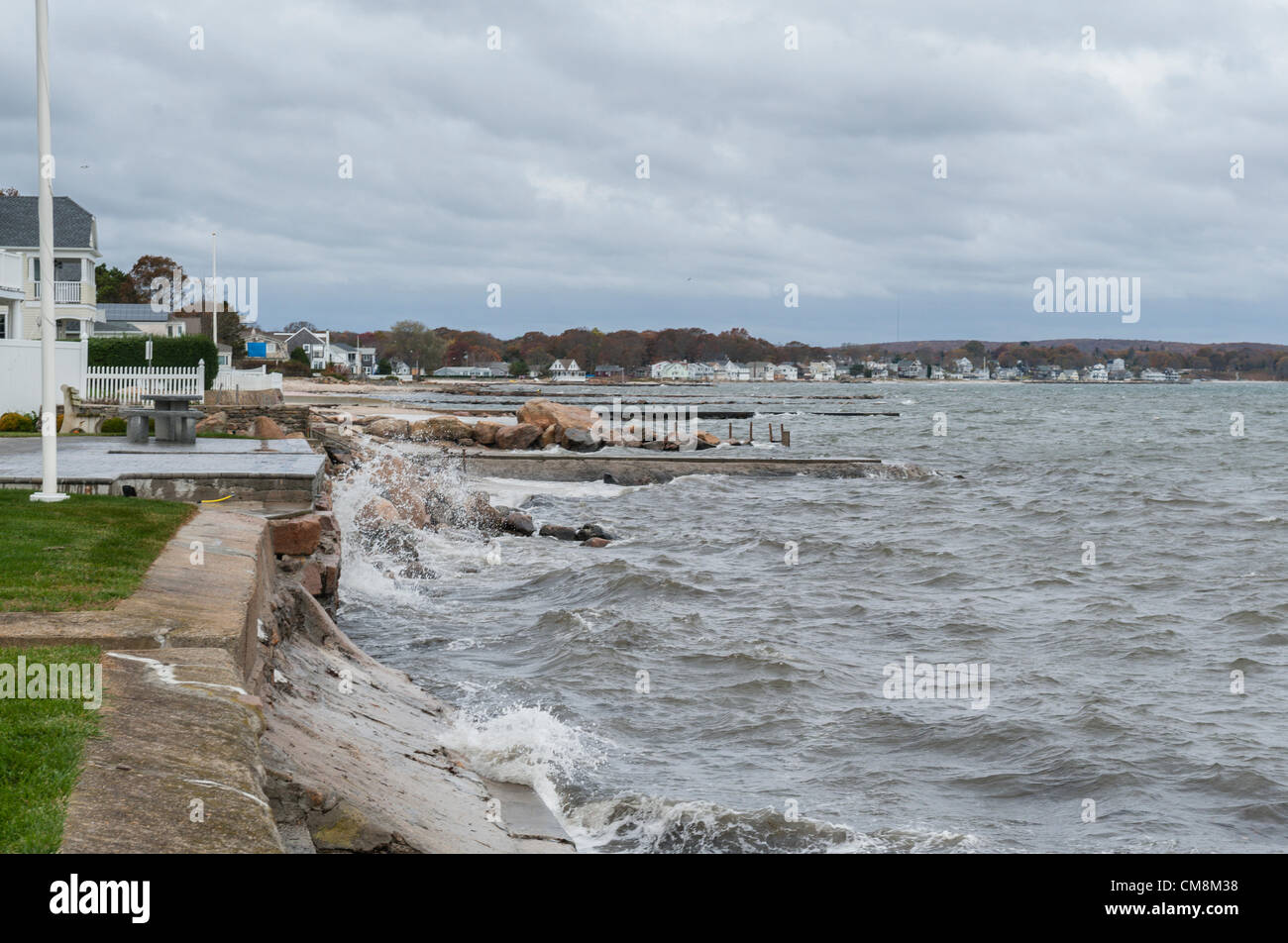 Niantic, East Lyme, Connecticut USA The day before Hurricane Sandy hit ( 28 Oct 2012) waves crash against the bulkheads built to protect homes along the Connecticut shoreline. Pictured is the beach community of Black Point. In the distance you can see Attawan Beach. Stock Photo