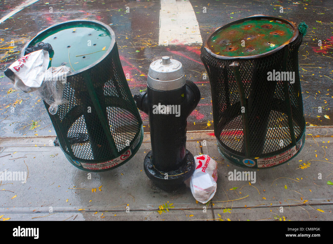 New York, NY 29 Oct 2012 Trash cans upside down to reduce risk of