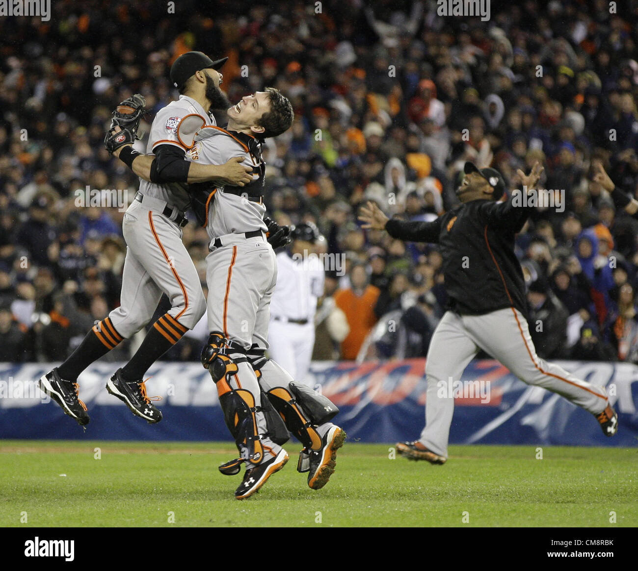 28.10.2012. Detroit, Michigan, USA. San Francisco Giants relief pitcher SERGIO ROMO and catcher BUSTER POSEY celebrate a 4-3 victory over the Detroit Tigers in the 10th inning of Game 4 of the 2012 World Series at Comerica Park. The Giants swept the series with the win Stock Photo