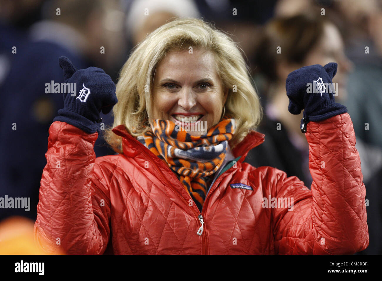 28.10.2012. Detroit, Michigan, USA. Ann Romney, wife of Republican presidential candidate Mitt Romney, shows off her Detroit gloves at Game 4 of the 2012 World Series between the Detroit Tigers and the San Francisco Giants at Comerica Park in Detroit, Michigan, Sunday, October 28, 2012. Stock Photo