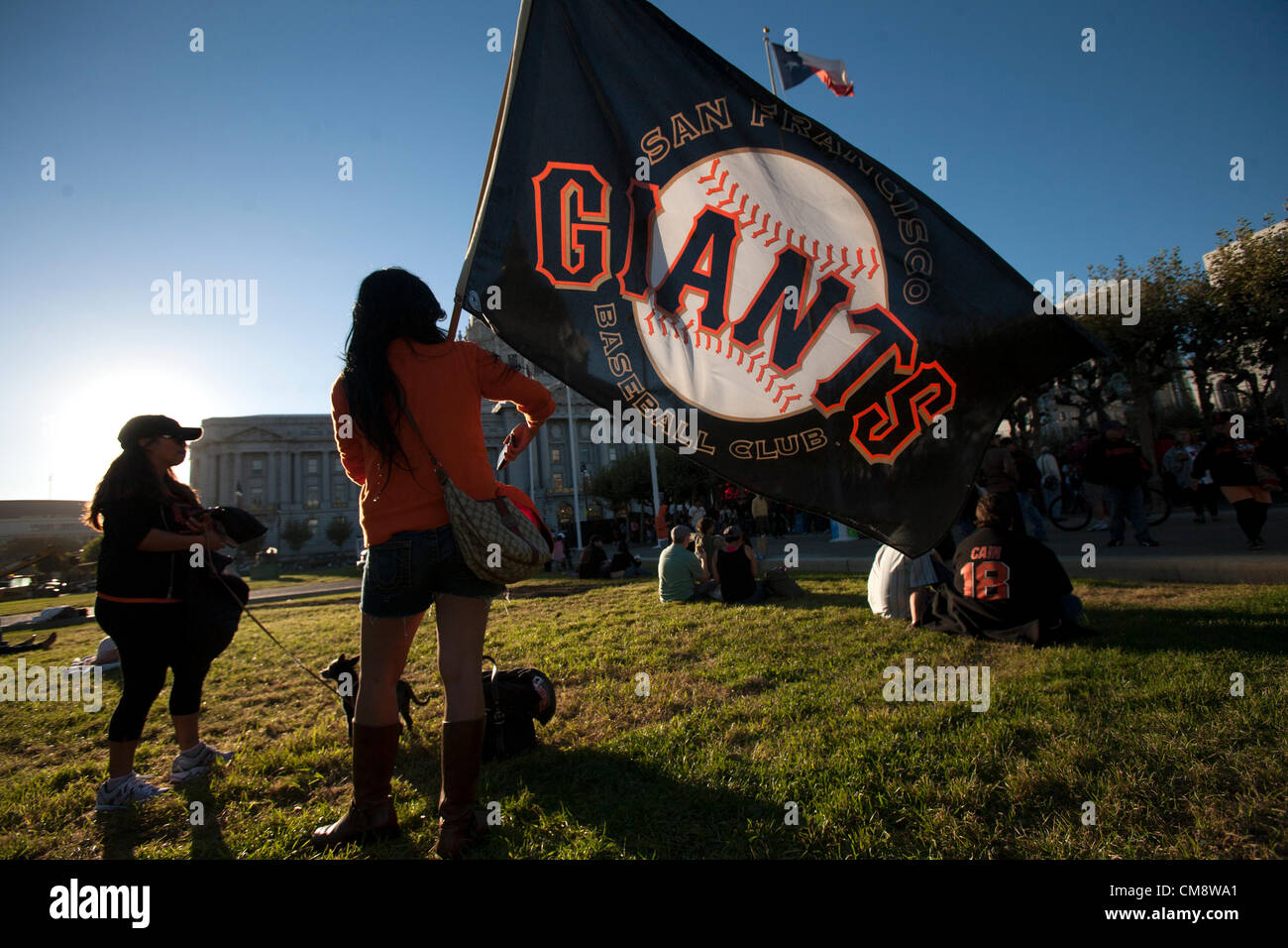 San Francisco, USA. 28th October 2012. A  San Francisco Giants fan awaits the start of game four near City Hall in downtown San Francisco California where city officials set up a giant television for people to watch the game live from Detroit on Sunday October 28, 2012. Stock Photo