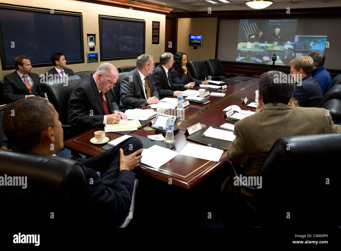 President Barack Obama receives an update on the ongoing response to Hurricane Sandy, in the Situation Room of the White House, Oct. 29 2012. Participating via teleconference, clockwise from top left, are:  Secretary of Homeland Security Janet Napolitano; FEMA Administrator Craig Fugate; Rick Knabb, Director of the National Hurricane Center; Secretary of Transportation Ray LaHood; and Secretary of Energy Steven Chu. Pictured, from left, are: Clark Stevens, Assistant Press Secretary; Emmett Beliveau, Credit: Archive Image/White House Stock Photo