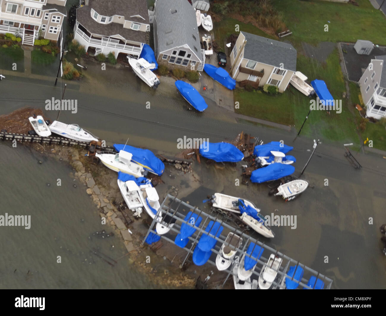 Boats are displaced in Brigantine, N.J., Oct. 30, 2012, after Hurricane Sandy made landfall on the southern New Jersey coastline, USA Oct. 29, 2012. The photo was taken by a Coast Guard crewmember aboard an MH-65 Dolphin helicopter from Coast Guard Air Station Atlantic City during a flooding assessment over flight. Credit: Archive Image/New Jersey National Guard Stock Photo