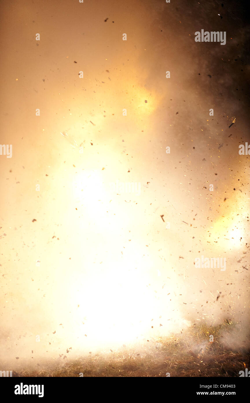 Oct. 26, 2012 - Brighton, Michigan, U.S - John Fletcher of Pinckney, 50, aka Ghengis John the Human Firecracker, blows himself up with 6000 firecrackers outside Burroughs Tavern in Brighton, MI on Oct 26, 2012. (Credit Image: © Mark Bialek/ZUMAPRESS.com) Stock Photo