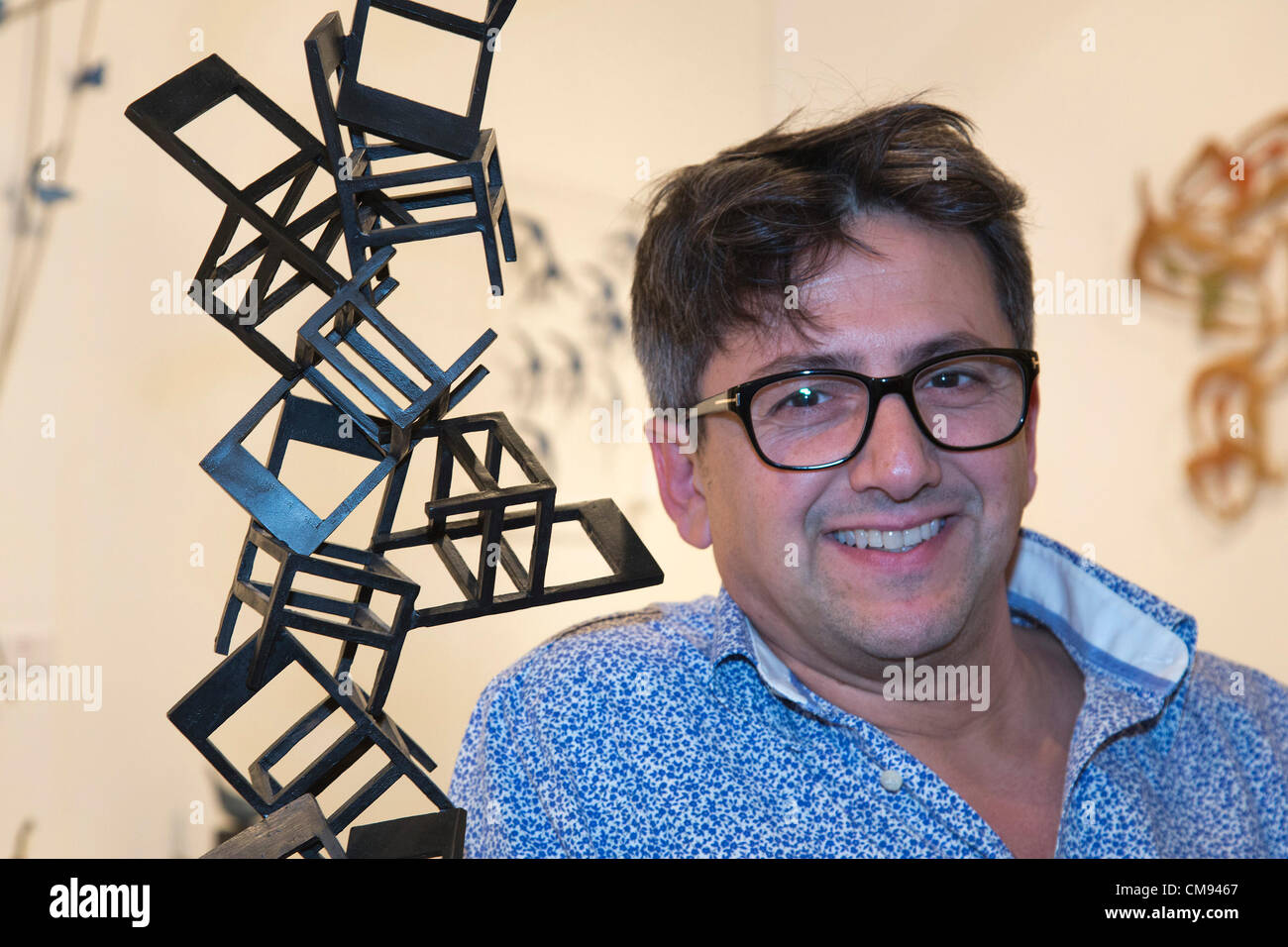 London, England, UK. Wednesday, 31 October 2012. Catalan sculptor Antonio López Reche next to his artwork. The Affordable Art Fair opens on Hampstead Heath, London. Over 18,000 people are expected to descend on the Heath for the event which will showcase the contemporary collections of over 100 galleries, from household names to emerging talent, all priced from £40 to £4,000. Picture credit: Nick Savage/Alamy Live News Stock Photo