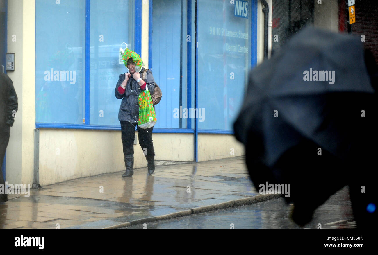 Brighton Sussex UK 1 November 2012 - Shoppers get caught in a heavy downpour in Brighton city centre today. Credit:  Simon Dack / Alamy Live News Stock Photo