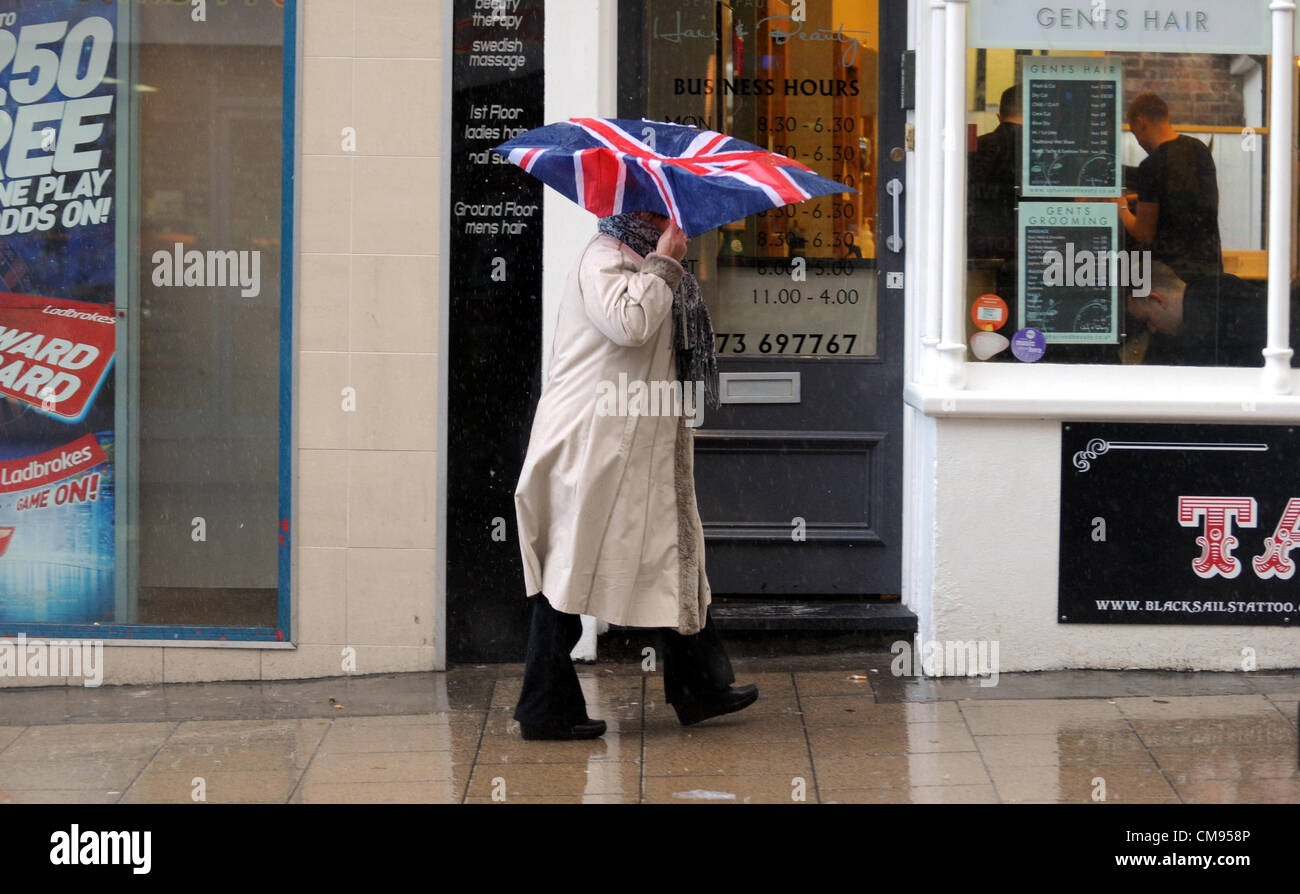 Brighton Sussex UK 1 November 2012 - Shoppers get caught in a heavy downpour in Brighton city centre today. Stock Photo