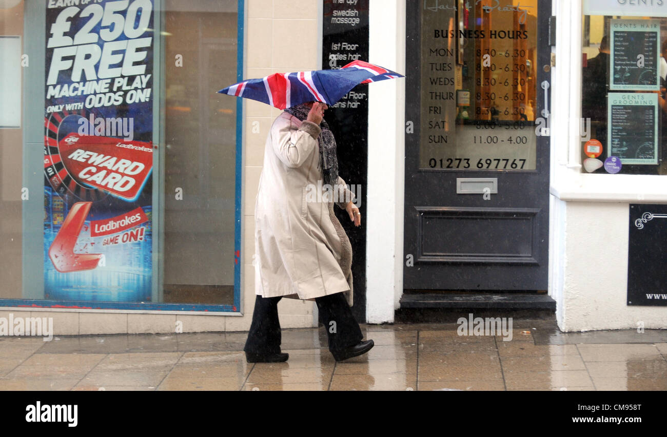 Brighton Sussex UK 1 November 2012 - Shoppers get caught in a heavy downpour in Brighton city centre today. Stock Photo