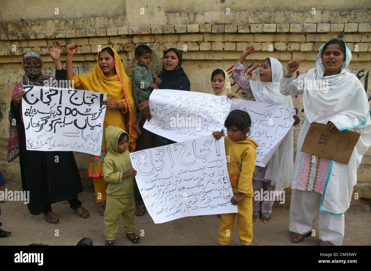 Residents of Tehsil Pattoki District Kasur chant slogans against SDO Public Health Department Mian Saleem during protest demonstration at Lahore press club on Thursday, November 01, 2012 Stock Photo