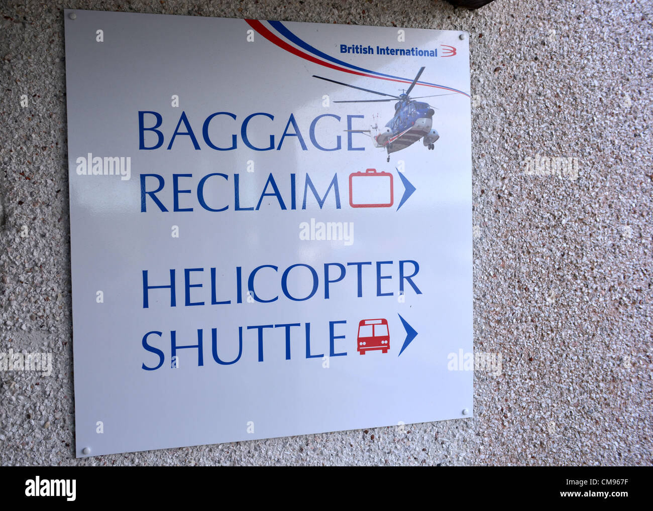 Baggage reclaim sign and helicopter shuttle sign, Isles of Scilly Stock Photo