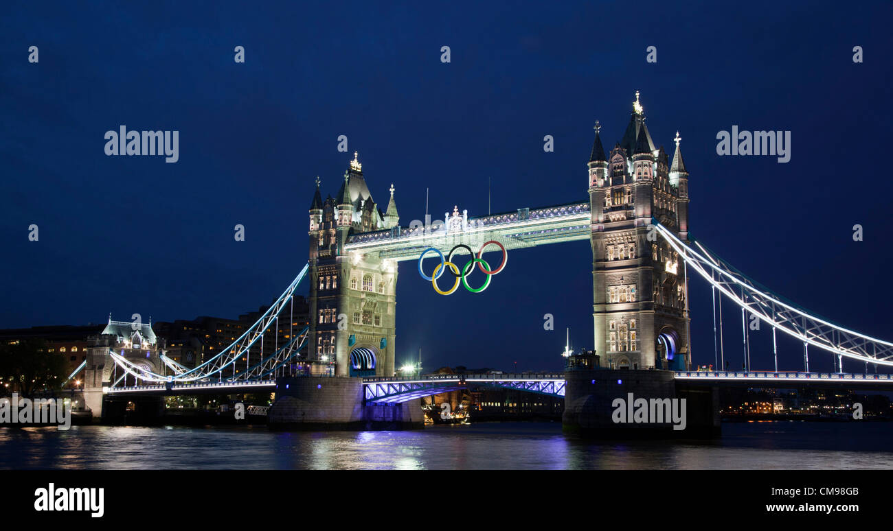 London, England, UK. Wednesday, 27 June 2012, Illumination of Tower Bridge with Display of the Olympic Rings One Month Before the Start of the 2012 Games in London. Stock Photo