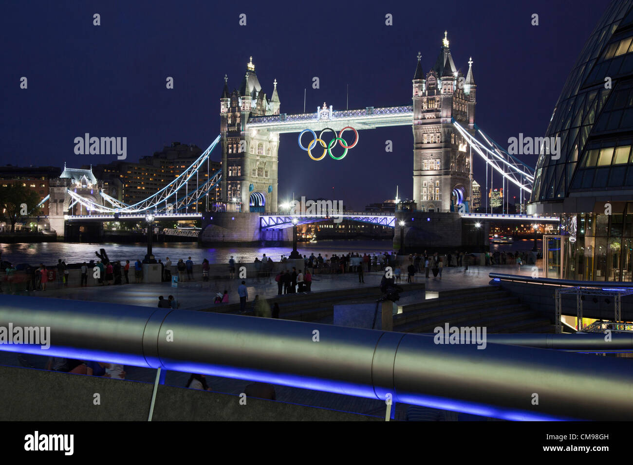 London, England, UK. Wednesday, 27 June 2012, Illumination of Tower Bridge with Display of the Olympic Rings One Month Before the Start of the 2012 Games in London. Stock Photo
