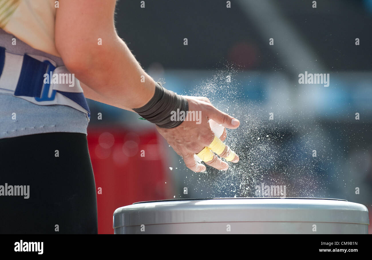28.06.2012. Helsinki, Finland.  Josephine Terlecki of Germany prepares her hands with chalk during the women's Shot Put qualification of the European Athletics Championships 2012 at the Olympic stadium in Helsinki, Finland, 28 June 2012. The European Athletics Championships take place in Helsinki from the 27 June to 01 July 2012. Stock Photo